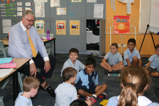 Greg Whitby sitting on a class at St Joseph